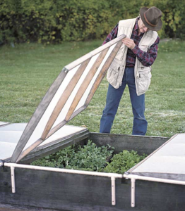 cold frame set up with a lid that flips upward