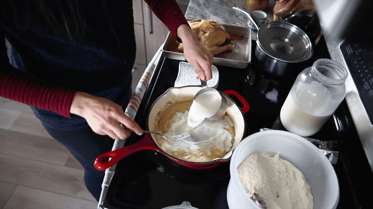 adding milk to basic white sauce